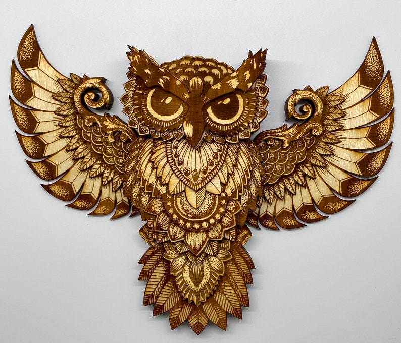 Thirteen layer engraved owl.  Varied colors of the engrave along with the layers give this owl depth and dimension.  Front view