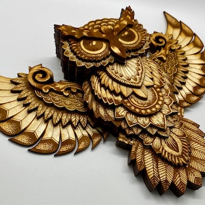 Thirteen layer engraved owl.  Varied colors of the engrave along with the layers give this owl depth and dimension.