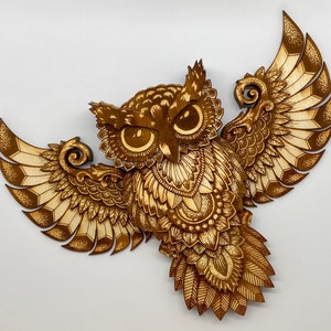 Thirteen layer engraved owl.  Varied colors of the engrave along with the layers give this owl depth and dimension.