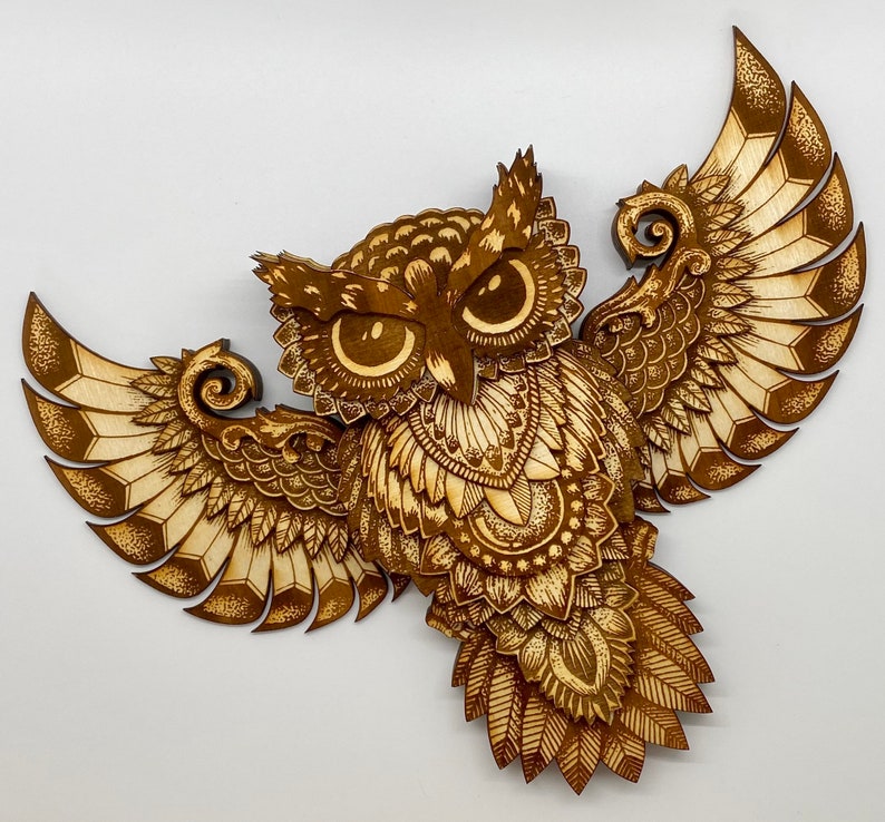 Thirteen layer engraved owl.  Varied colors of the engrave along with the layers give this owl depth and dimension.