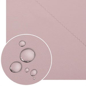 Puede incluir: Primer plano de una tela rosa con un tejido texturizado. Se ven varias gotas de agua, lo que sugiere un material impermeable o resistente al agua. La tela es de color rosa liso y apagado.
