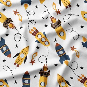 Fabric by the Yard - Yellow and Blue Rockets with Stars on White Cotton Fabric, Perfect for Boys' Quilting, DIY Projects, Home Decor