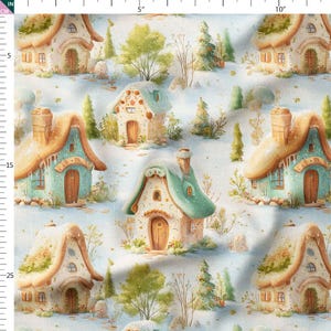 May include: Fabric with a repeating pattern of whimsical cottages in a snowy landscape. The cottages have brown, green, and blue roofs, with details like chimneys and arched doorways. The background is a soft, light blue with trees and snow.