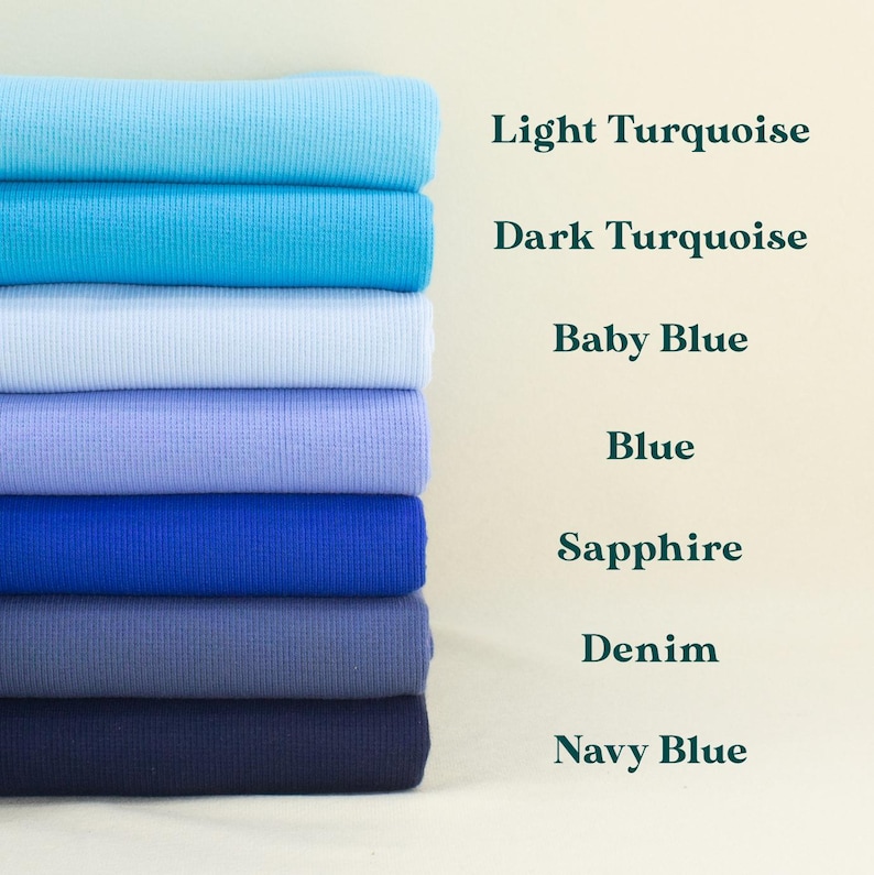 A stack of seven different colored fabric swatches, each labeled with its name: Light Turquoise, Dark Turquoise, Baby Blue, Blue, Sapphire, Denim, and Navy Blue.