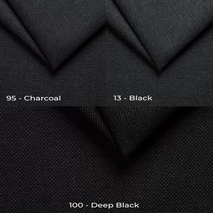 a close up of a black fabric with different colors