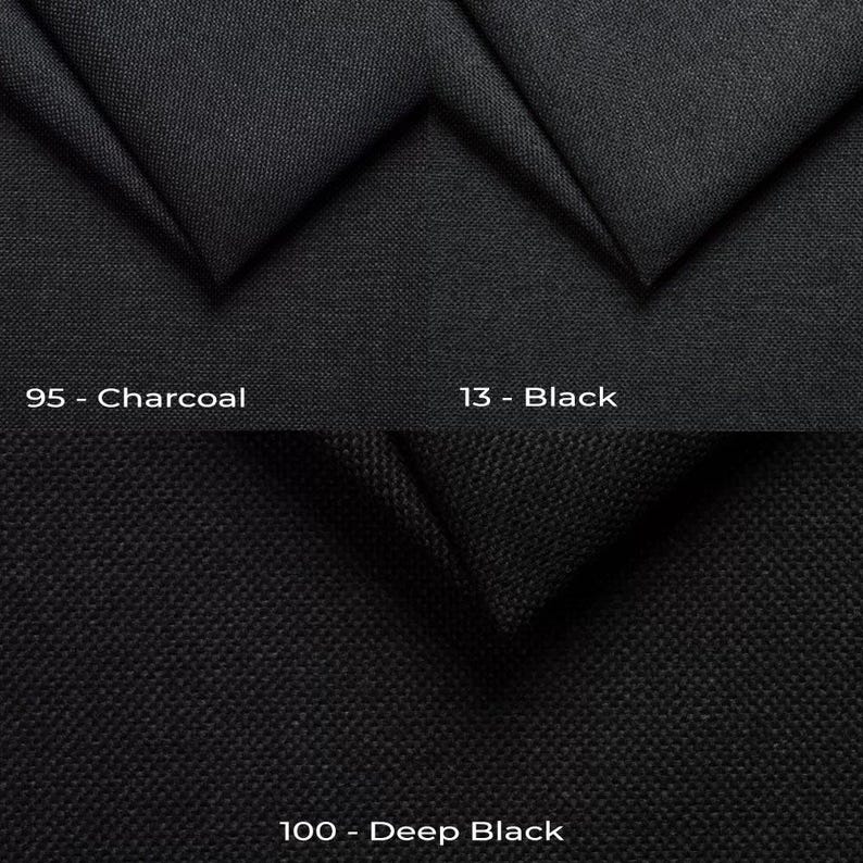 a close up of a black fabric with different colors