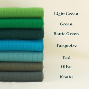A stack of various fabric swatches in different colors, including Light Green, Green, Bottle Green, Turquoise, Teal, Olive, and Khaki.