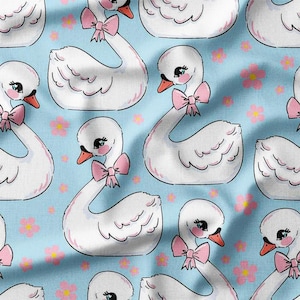 Charming Swans with Pink Bows and Flowers on Blue Cotton Fabric by the Yard – Elegant Design for Kids&#39; Clothing, Quilting, and Home Decor