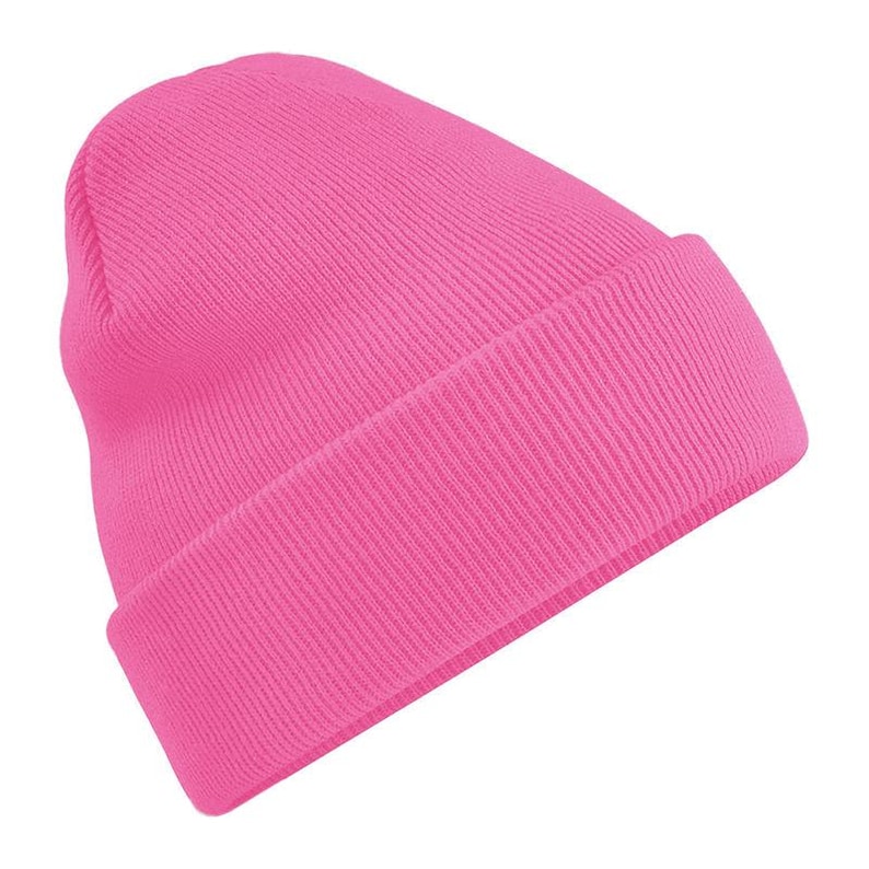 A bright pink knit beanie with a high collar and a low front.