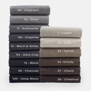 a stack of folded towels with the names of each product