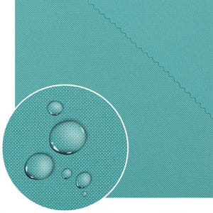 May include: Close-up of a teal fabric with a woven texture. Water droplets are visible on the fabric, indicating a waterproof or water-resistant quality. The fabric has a clean, modern appearance, suitable for outdoor or protective applications.