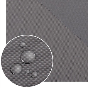May include: A close-up of grey fabric with water droplets, demonstrating its water-resistant properties. The fabric has a tight weave and a solid grey colour. The image suggests a durable, weather-resistant material suitable for outdoor use.