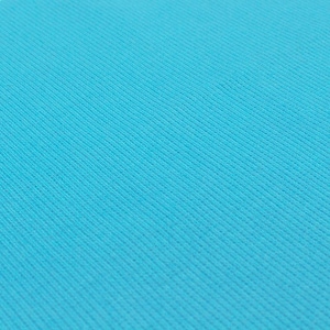 A close-up image of a blue fabric with a diagonal pattern, creating a textured and visually interesting surface.