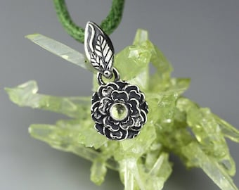 Dainty flower pendant, tiny, silver and peridot, miniature leaves, silver petals, silver peony, tiniest silver flower, micro pendant, green