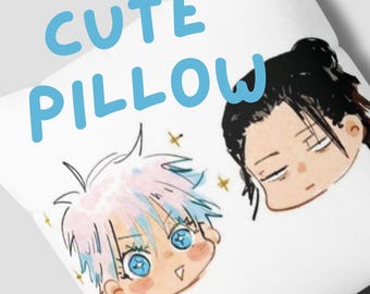 May include: A white pillow with the text "CUTE PILLOW" in blue lettering. The pillow features a cartoon illustration of two characters with pink and blue hair. The characters have large eyes and are smiling.