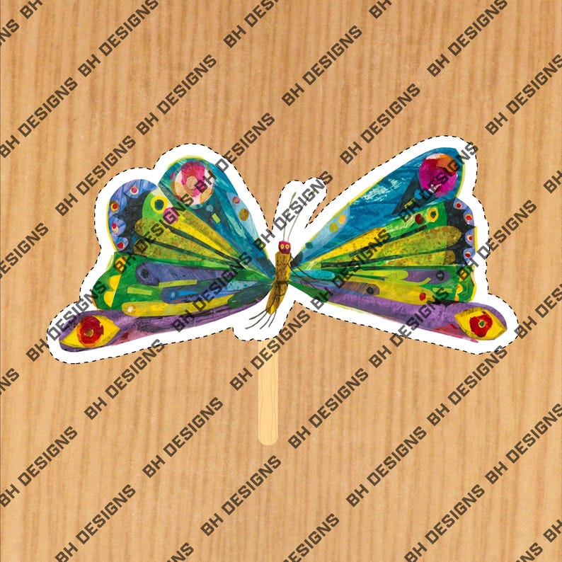 May include: A brightly coloured butterfly craft with a wooden stick handle. The butterfly has a vibrant design with blue, green, yellow, purple, and red hues. The wings have a detailed pattern, set against a light brown background.