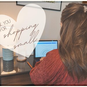 May include: A woman working on a laptop computer with a heart-shaped graphic overlay that says "Thank you for shopping small".