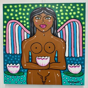 May include: A vibrant painting of a nude figure with brown skin, black hair, and pink lips. The figure has colorful wings and is holding a lotus flower. The background features a green and blue dotted pattern, with two additional lotus flowers.