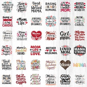 May include: A collection of graphic designs with text, featuring phrases like "Mom Life," "Mama with a big heart," and "Being a Mom is my Cardio." The designs use various fonts and decorative elements, including hearts and floral accents.