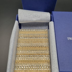 Swarovski goudkleurige metallic kaarthouder met goud- en zilverkleurige swarovski kristallen