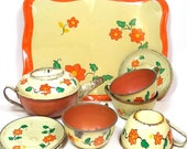 1930s Tin Toy Tea Set. Orange flowers by Ohio Art Co. 11 pieces.