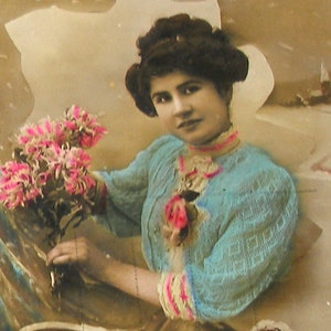 1900s French postcard.  Lady with shoe. RPPC, real photo postcard, paper ephemera. Carte Postale. Vintage collectible.