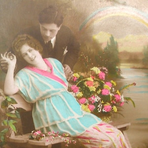 1920s French postcard with romantic couple & rainbow. RPPC Real photo, paper ephemera. Carte Postale. Vintage collectible.