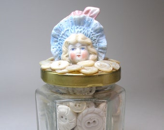 Antique & vintage buttons in jar. German doll head. 5.25"