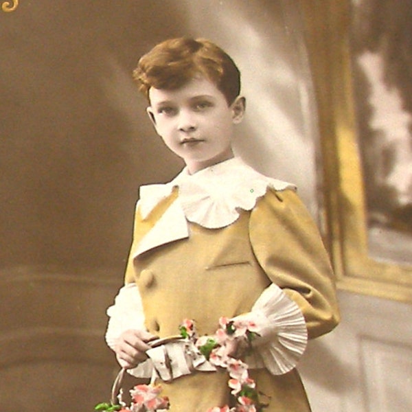 1900s French Postcard. Edwardian boy with flowers. RPPC real photo, paper ephemera. Carte Postale. Vintage collectible.