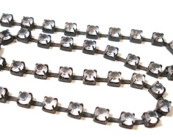 1 foot rhinestone chain. Gun metal finish.  7mm,