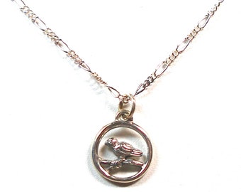 Tiny bird sterling silver necklace. 18". Bird on a branch.