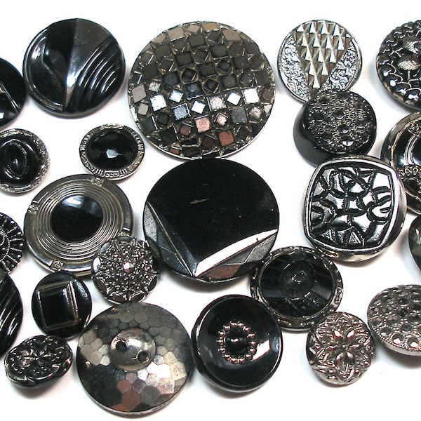 24 Art Deco black glass buttons. Early 20th century glass with silver luster.