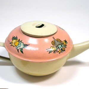 1937 Tin Toy Tea Pot with birdhouse & flowers. Made by Ohio Art Co. USA. Vintage collectible