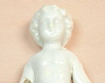 3 1/4" Frozen Charlotte doll from Germany. Antique porcelain.
