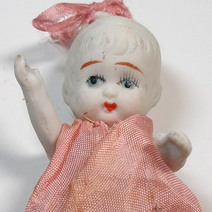 1930s TLC dolly. Articulated arms & legs, made in Japan. 5".