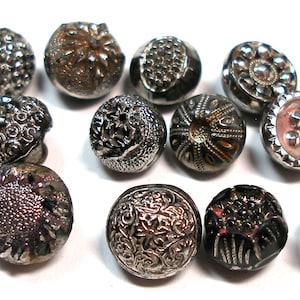 12 Victorian black glass buttons. Antique 19th century ball glass with silver luster.