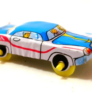 Mini 1960s Japanese tin toy car, blue & white with red stripe. Vintage Japan.