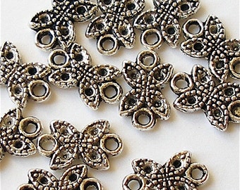 12 Baby butterfly connectors. Tibet silver beads, charms.