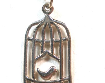 Small caged bird sterling silver necklace. 18".