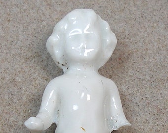 2 3/8" Frozen Charlotte doll from Germany. Antique porcelain.