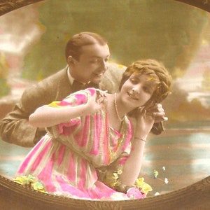 Playful couple 1920s French postcard, RPPC. Real photo postcard, paper ephemera. Carte Postale. Vintage collectible.