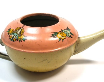 1937 blikken speelgoedtheepot met vogelhuisje en bloemen. Gemaakt door Ohio Art Co. USA.