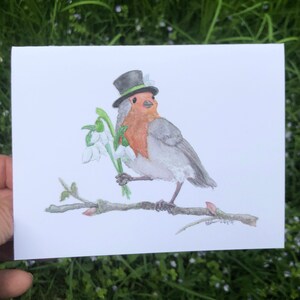 Um pequeno cartão de visita com um tordo-inglês (em branco por dentro)