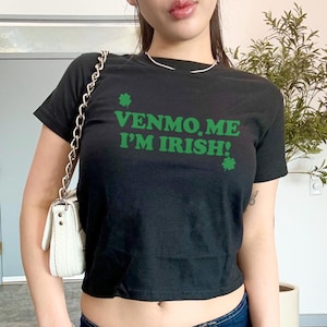 May include: Black cropped t-shirt with green shamrock graphics and the text "Venmo. Me I'm Irish!"