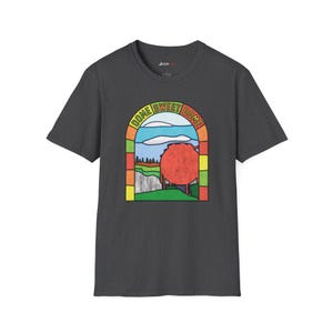 May include: A dark grey t-shirt featuring a colourful graphic of a stained glass window with the text "Dome Sweet Dome".