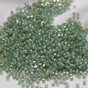 1.5mm Toho cube Toho Rainbow Light Topaz Seafoam lined, 10-gram bag, Color# T1.5C-952