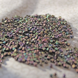 Demi 8-84, Toho 8g Metallic Iris Green/Brown Demi 8-84, Toho 8g Metallic Iris Green/Brown