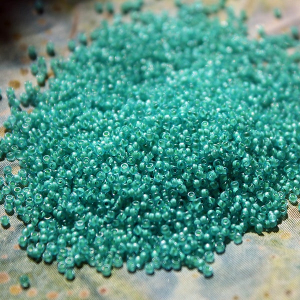 15/0 Frosted Aqua/Lt Jonquil lined Toho seed bead, 10 gram bag, Color# TR-15-954F