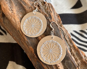 Chartres Sacred Geometry Earrings - Hand Embroidered - Light Grey on sealed Beige Paper.