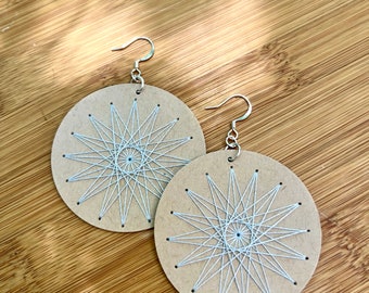 Scandinavian Star Sacred Geometry Earrings Hand Embroidered Light Gray on Beige Paper